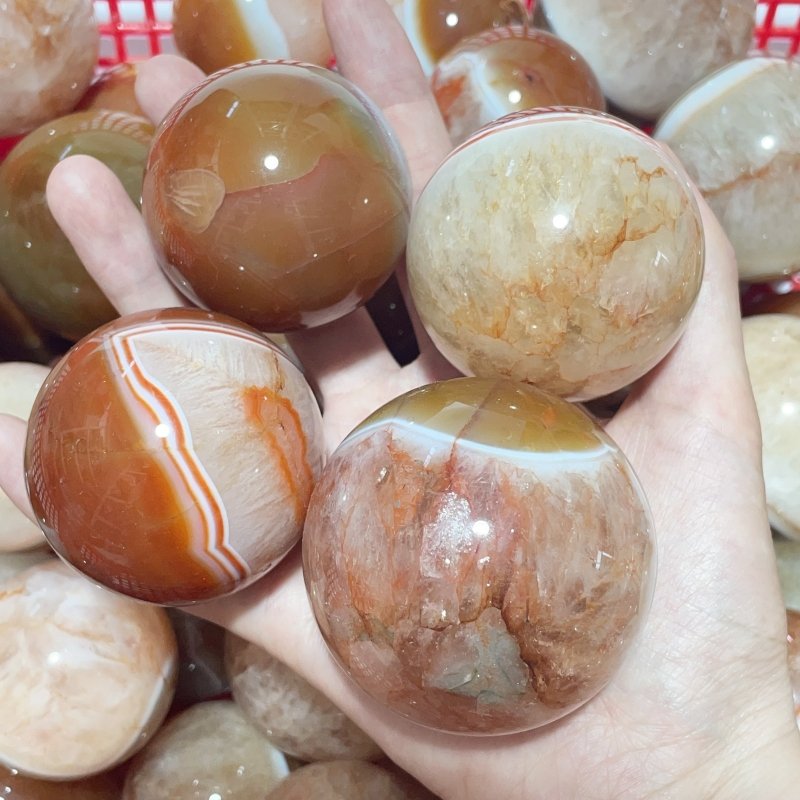 1.5 - 2.7in Carnelian Mixed Quartz Stripe Spheres Wholesale - Wholesale Crystals