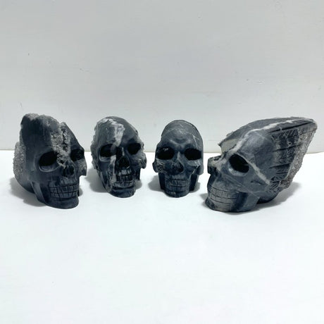 4 Pieces Black Clear Quartz Cluster Skull Carving - Wholesale Crystals