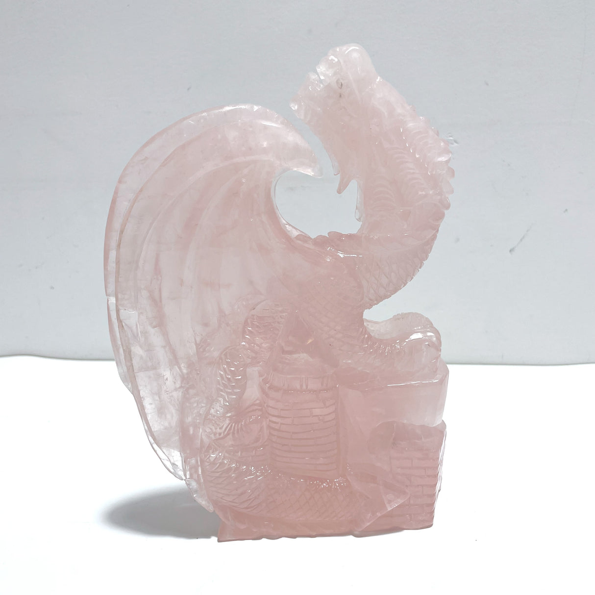 Beautiful Rose Quartz Flying Dragon Castle Carving