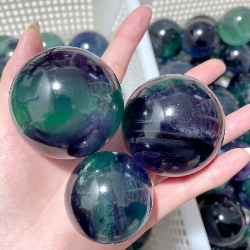 71 Pieces 57.8lbs Deep Green/Purple/Blue Fluorite Spheres - Wholesale Crystals